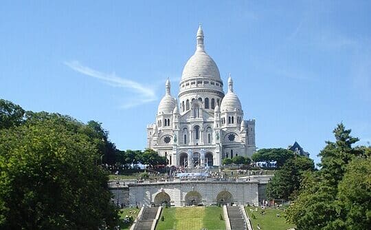 Image of the Basilica of the Sacred Heart of Jesus in Paris, France. Discover the Devotion and History of the Sacred Heart, and the Churches associated with it in the Catholic Mass Times app on your cell phone.